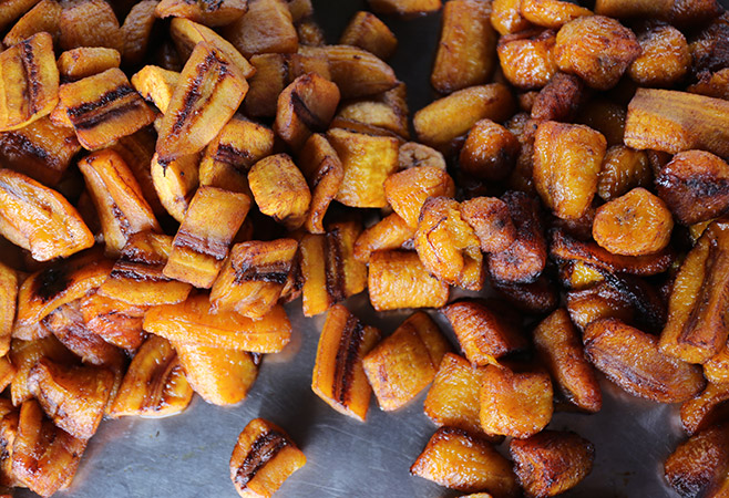 Popular Ivorian street desserts prepared fresh with banana and palm sugar.